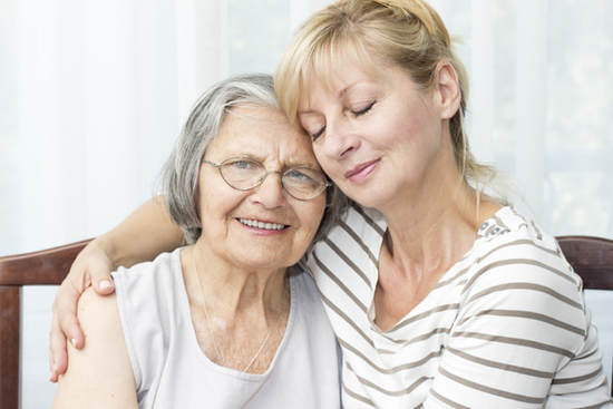 Photograph of elderly senior woman with daughter